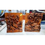 A pair of heavily carved Oriental bookends