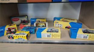 A collection of boxed modern Corgi cars etc.