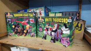 A collection of Power Rangers toys