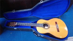 A Spanish guitar and case