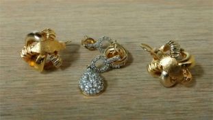 A pair of 18ct gold earrings and a pair of 9ct gold earrings, total weight 7.8 grams