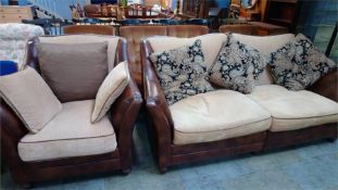 A leather and cloth settee and armchair