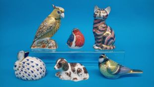 Six Royal Crown Derby paperweights; Sitting cat, Robin, Great tit, Citron cockatoo, Rabbit and