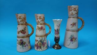 Pair of Royal Worcester blush ivory jugs decorated with flowers, a larger jug with similar