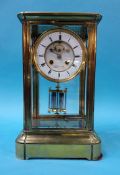 A large brass and four glass mantle clock, the dial signed 'Lister and Sons Newcastle on Tyne', 36cm
