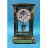 A large brass and four glass mantle clock, the dial signed 'Lister and Sons Newcastle on Tyne', 36cm