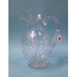 A large good quality cut glass water jug, 34cm tall