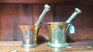 Two brass pestle and mortars