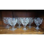 Six heavy cut glass wine glasses