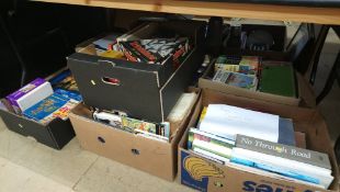 Seven boxes of books and puzzles