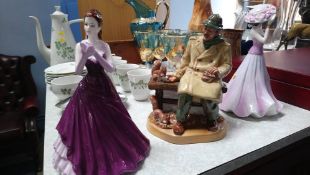 A Royal Doulton figure and two Coalport ladies
