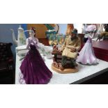 A Royal Doulton figure and two Coalport ladies