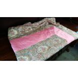 A pink and paisley quilt