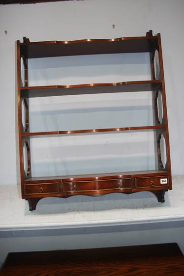 A set of reproduction mahogany wall shelves