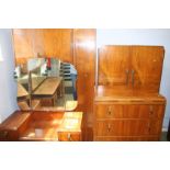 A walnut four piece bedroom suite, comprising wardrobe, gents robe, chest of drawers and a