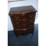 A reproduction mahogany serpentine chest of drawer