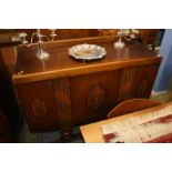 An oak three door sideboard