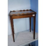 A small pair of mahogany occasional tables