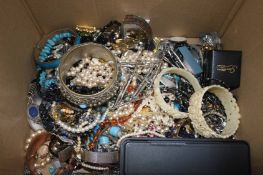 Box containing assorted loose costume jewellery in