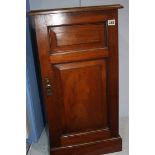 A mahogany bedside cabinet