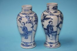A pair of Chinese blue and white vases, decorated