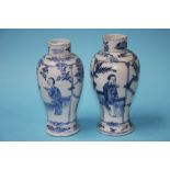 A pair of Chinese blue and white vases, decorated