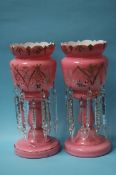 A pair of Victorian pink glass lustres with clear
