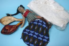 A beaded purse, christening gown, a pipe and a dol
