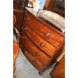 A mahogany bow front chest of five drawers