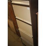 A metal four drawer filing cabinet