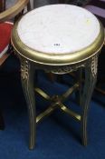 A gilt and marble top pedestal