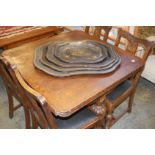 An oak drawer leaf dining table and four chairs