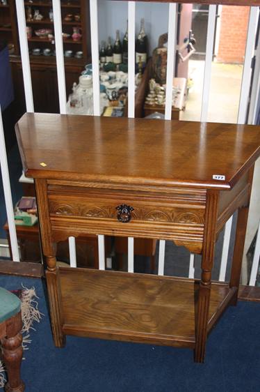 An oak single drawer side table