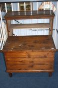 A pine bookcase and pine trunk