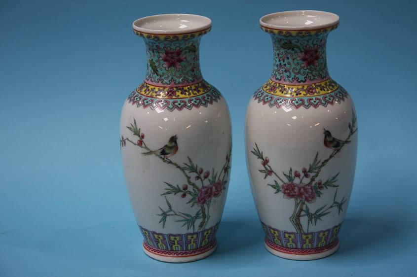 A small pair of Chinese vases and a figure on hors