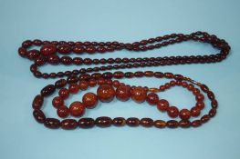 Two strings of amber coloured beads