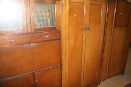 Two oak wardrobes and a kitchen cabinet