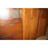 Two oak wardrobes and a kitchen cabinet