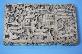 A heavily carved Oriental card case