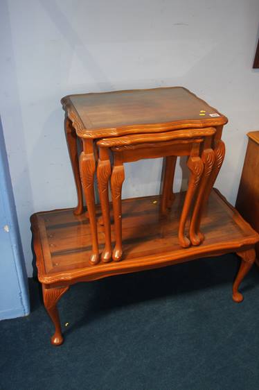 A yew wood nest of tables and a coffee table