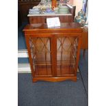 A reproduction yew wood bookcase, 88 x 32cm