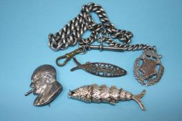 A silver watch chain, an articulated fish and a Wi