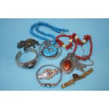 Assorted jewellery, silver bangles and coral neckl