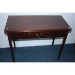 A Georgian mahogany fold over tea table with singl