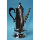 A large silver plated coffee pot and burner