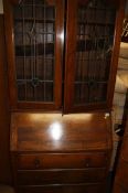 A walnut chest of drawers and a mahogany bureau bookcase (2)