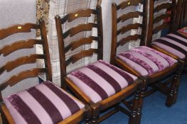 A set of four oak ladderback chairs