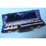 A white metal Emmerson flute and case