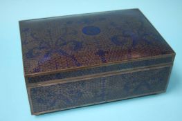 A good quality Cloisonné box on a dark blue ground
