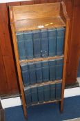 Oak bookcase and eighteen volumes of Charles Dicke